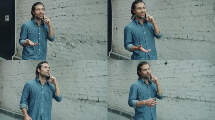 开朗的中东男子在手机上聊天，在城市的户外散步和打手势