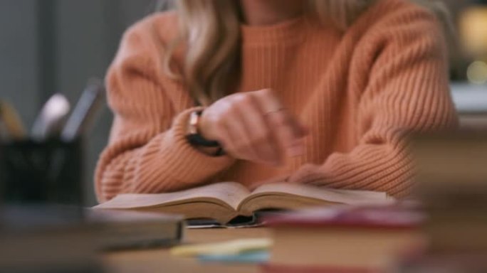4k视频片段，一名妇女在阅读教科书时追踪她的教科书