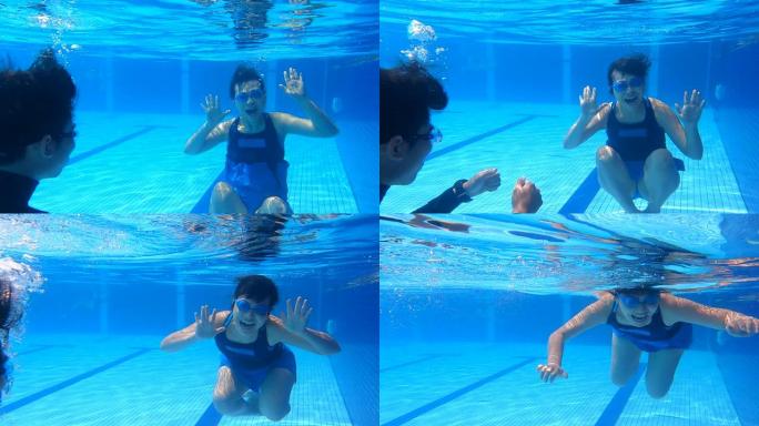 亚洲华裔熟女与教练在水中练习呼吸运动