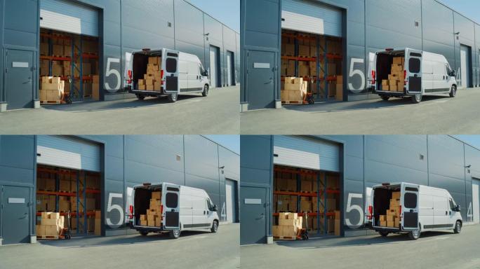 在开门的物流仓库外面，装着纸箱的送货货车。卡车送货在线订单，采购，电子商务商品，批发商品。建立宽镜头