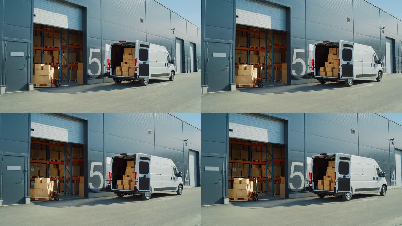 在开门的物流仓库外面，装着纸箱的送货货车。卡车送货在线订单，采购，电子商务商品，批发商品。建立宽镜头