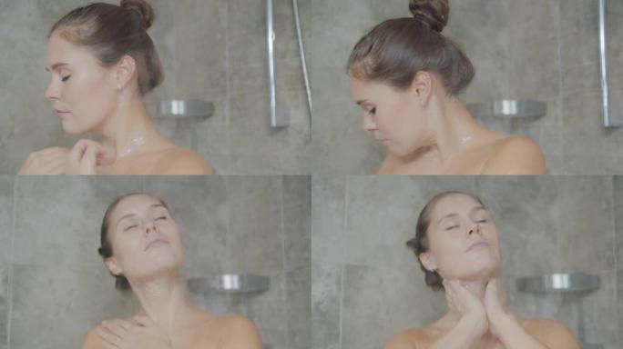 慢镜头，迷人的女孩在淋浴时用泡沫清洗皮肤