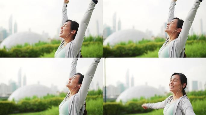 成功运动女子在城市里锻炼时欢呼