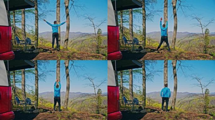 棕色短发的男人早上在大自然中进行健身锻炼，站在大自然的小山上，背景是美丽的风景