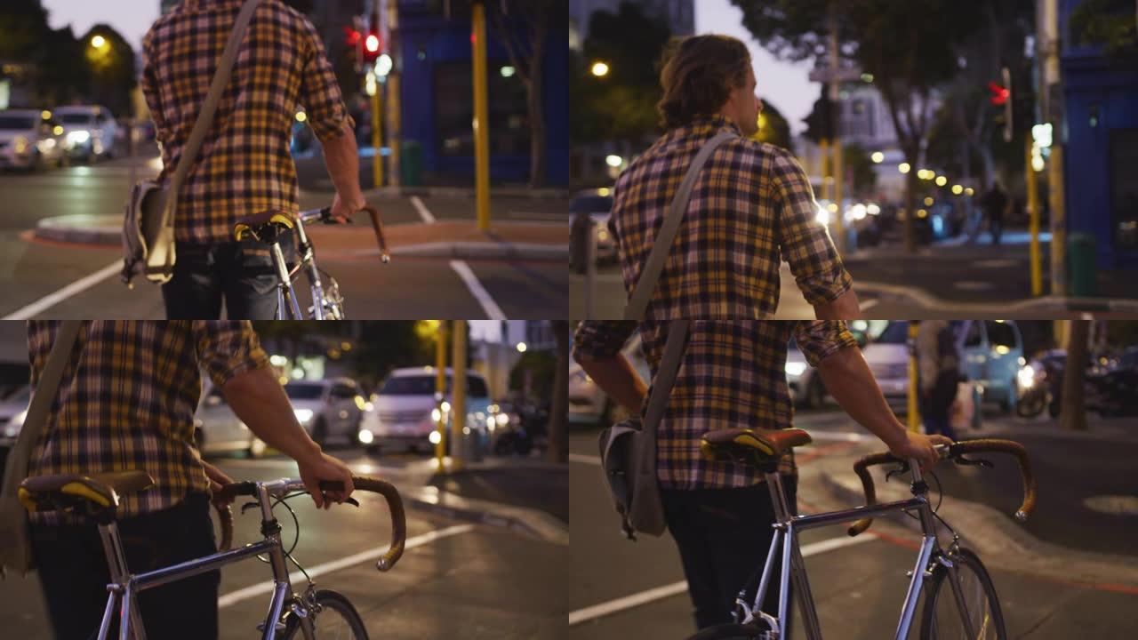 白人男性晚上骑着自行车在街上过马路