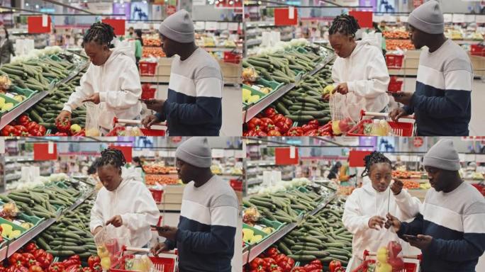 非裔美国夫妇在超市购买农产品