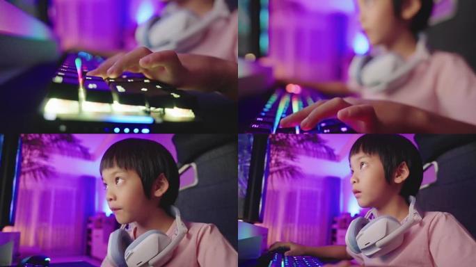 倾斜男孩的手使用RGB键盘在他的电脑上玩视频游戏