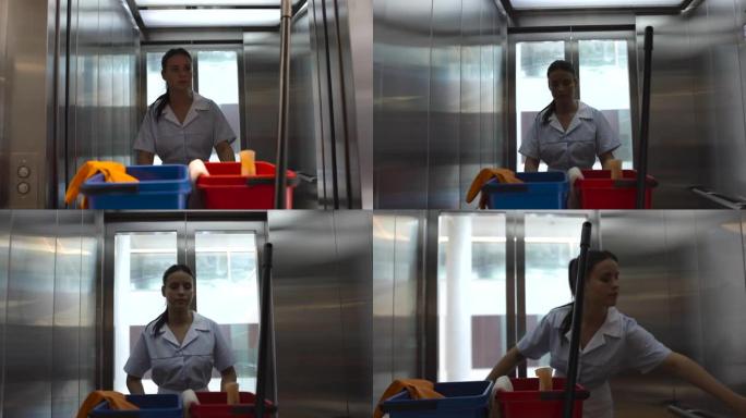 年轻女子在医院当清洁工，拉着手推车进入电梯