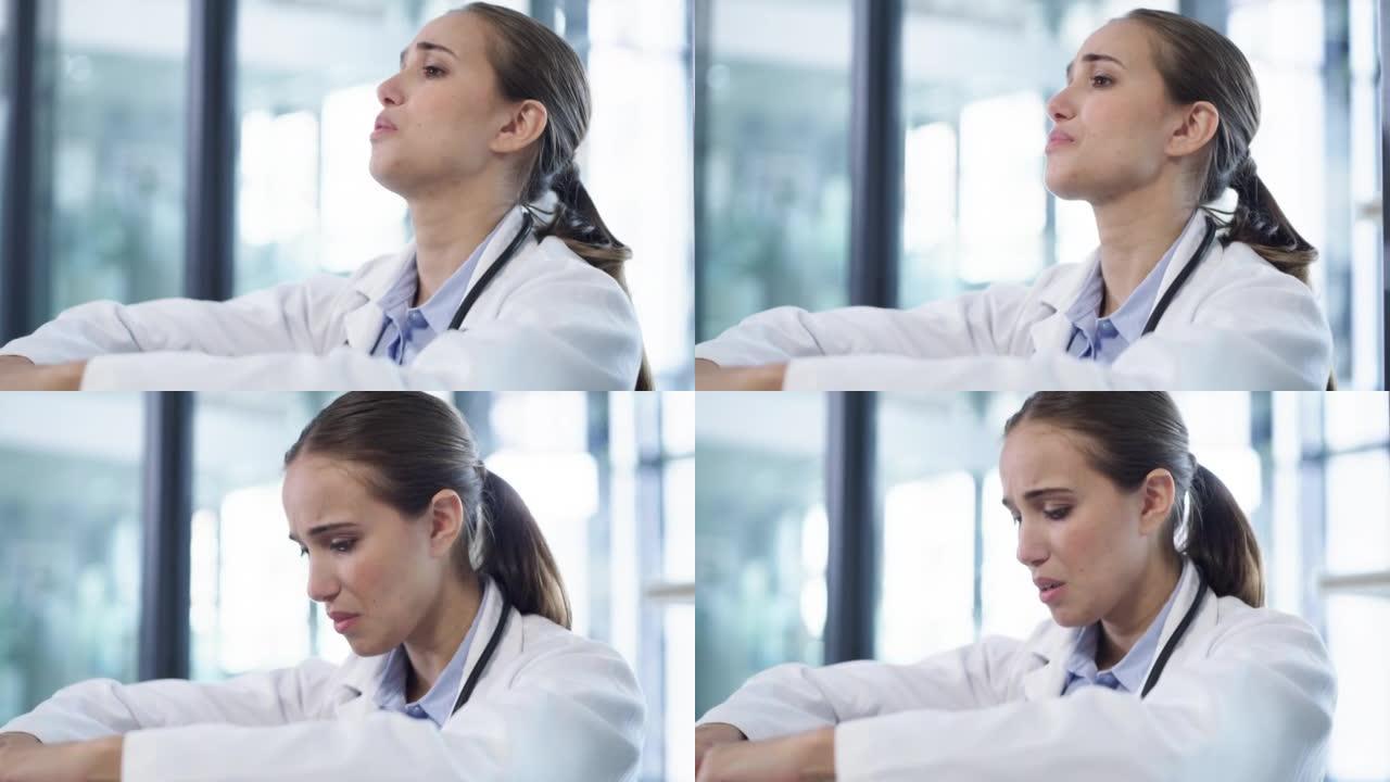 4k视频片段，一名年轻医生在现代医院中看起来压力很大