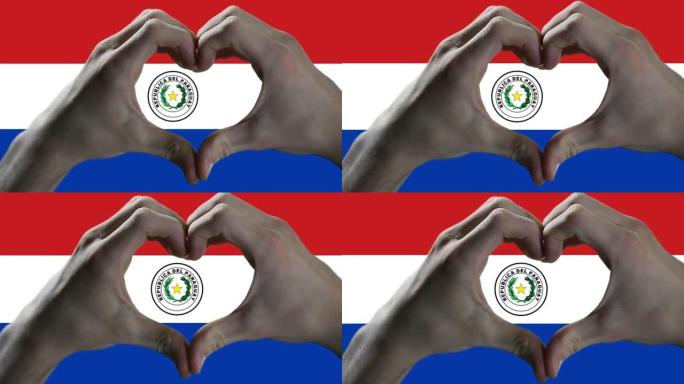 双手在巴拉圭国旗上显示心脏标志。