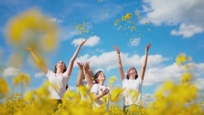 超级SLO MO家族在空中扔黄色花朵