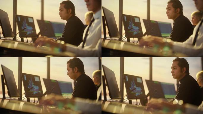 戴着耳机的男性空中交通管制员的肖像在机场塔台通话。办公室里满是台式电脑显示屏，配有导航屏幕、飞机飞行