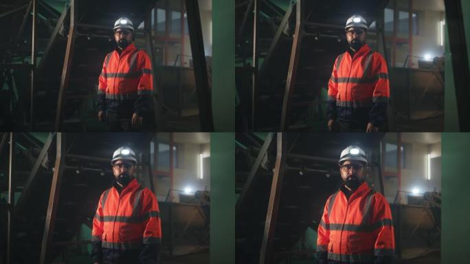 男工程师在机械附近看着相机