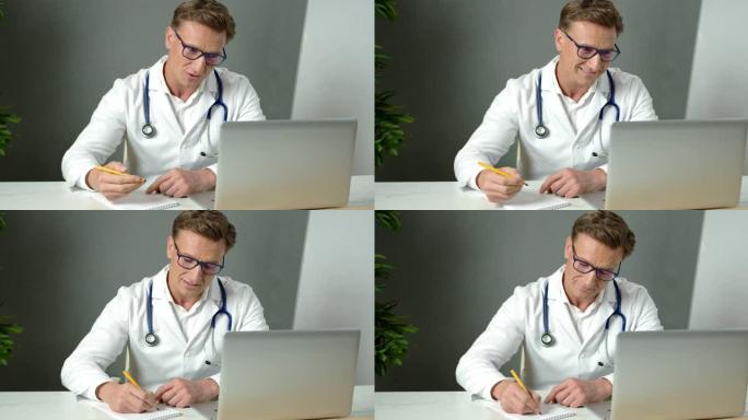 英俊的男医生在视频会议上与远程病人一起工作，使用在线虚拟聊天。远程会诊医疗专业微笑远程医疗计算机应用