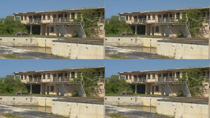 在田园诗般的加勒比海，被遗弃的酒店和游泳池在酷热中腐烂。