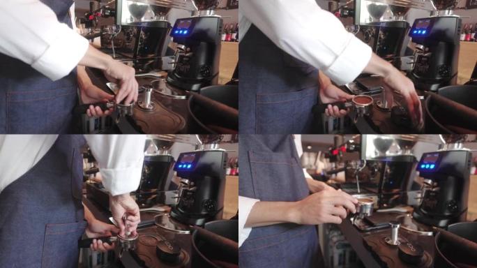 咖啡师在咖啡馆用咖啡机械准备咖啡