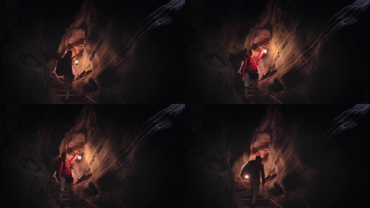 用灯探索洞穴的人冒险家地质学家