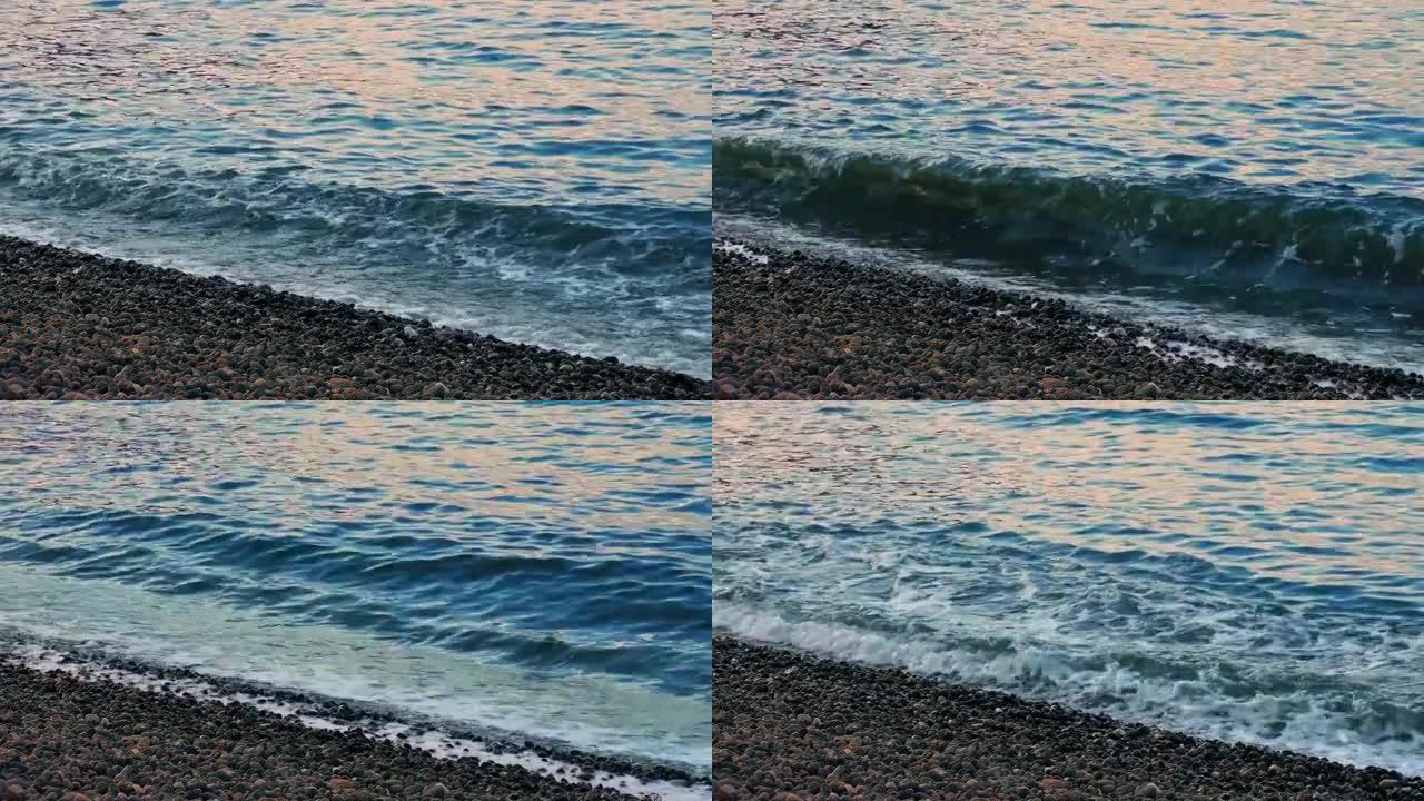 日落时分，五颜六色的海浪在岸边
