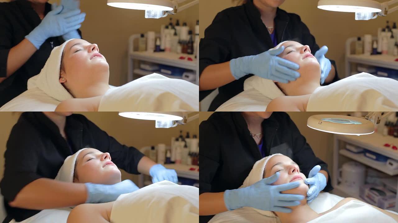 在水疗中心接受皮肤磨损美容治疗的妇女