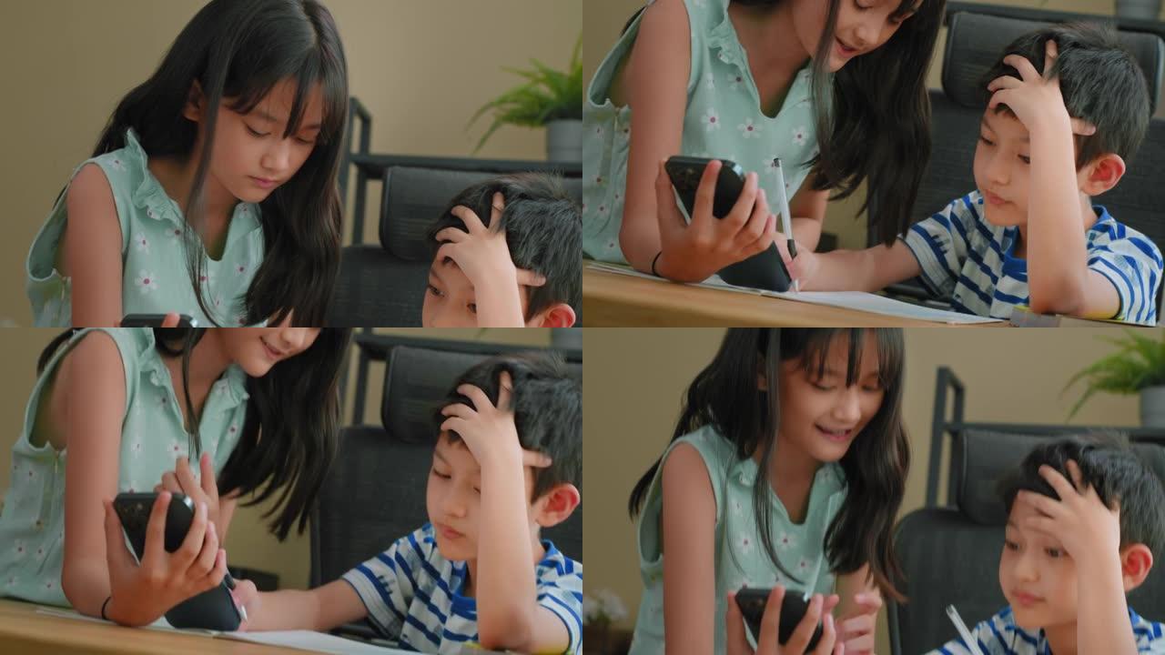 可爱的亚洲姐姐正在帮助弟弟做作业
