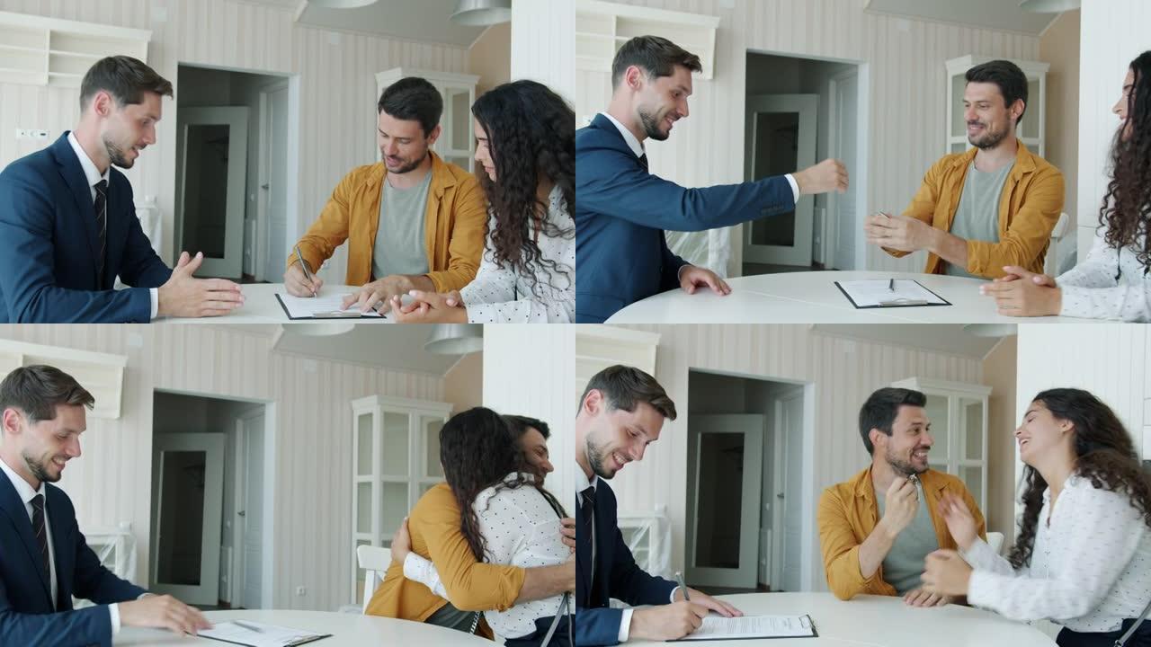 快乐的男人签署买卖协议从经纪人那里得到钥匙，握手拥抱妻子