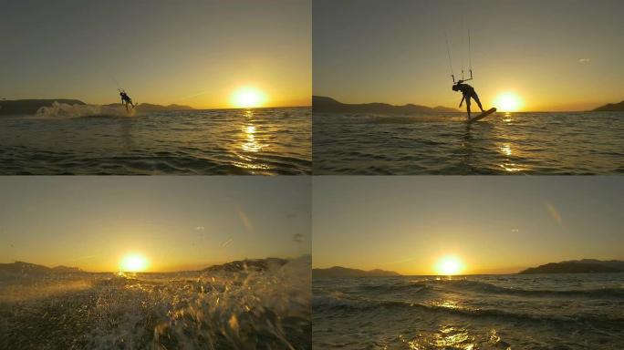 慢动作: 风筝冲浪者跳跃并将水溅入相机