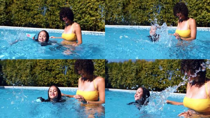 母亲帮助女儿在游泳池里用浮子游泳