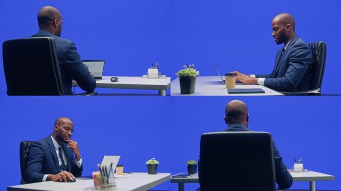 绿屏办公室背景: 坐在办公桌前的黑人商人在笔记本电脑上工作。从事数据电子商务分析的非洲裔美国人。36