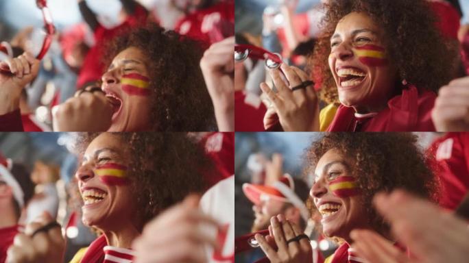 体育馆足球比赛: 美丽的双性恋球迷女孩肖像与西班牙国旗彩绘的脸欢呼队获胜，击败铃鼓。人群庆祝进球，冠