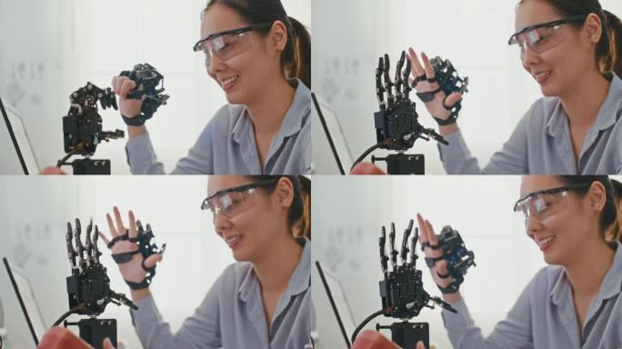 机器人手臂由专业开发工程师在高科技研究实验室中使用现代计算机设备进行测试