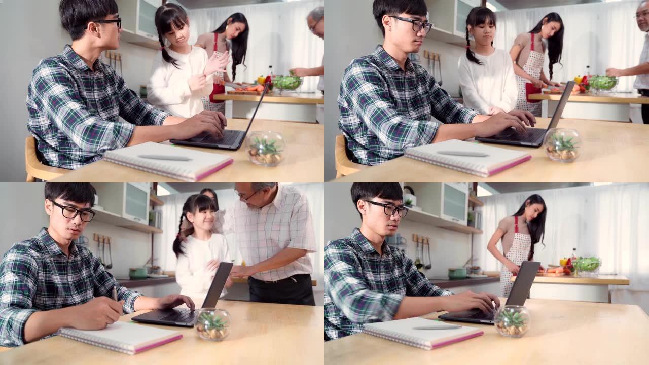 4K UHD多莉镜头: 女儿在家里等着忙碌的爸爸工作，而妈妈和祖父在厨房做饭。在家工作，同时封城新型