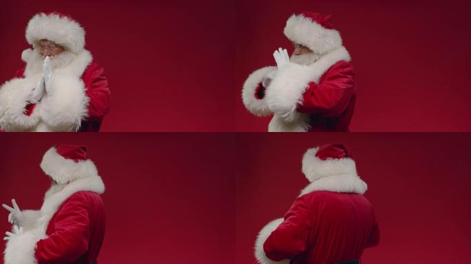 一个转身的圣诞老人戴着白手套擦手，右边的复制空间，我们看到他在红色背景上