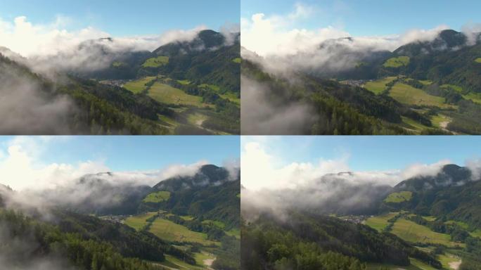 无人机: 被朱利安阿尔卑斯山包围的高山小镇的壮观航拍。