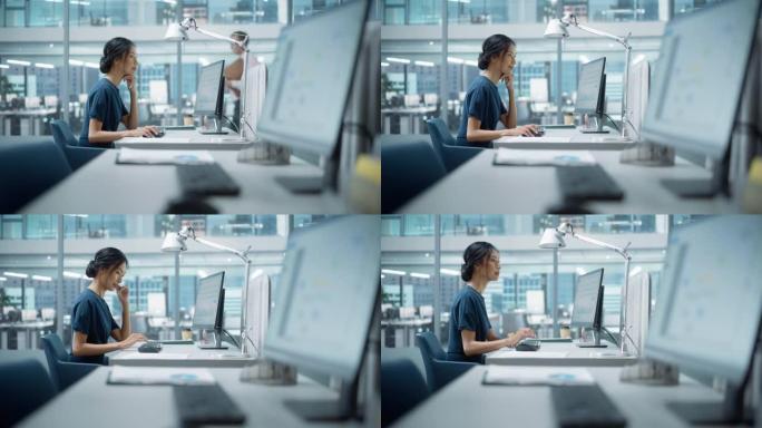 在大型多元化公司办公室中: 使用台式计算机的美丽亚洲经理肖像，女商人管理公司运营，分析统计数据，商业