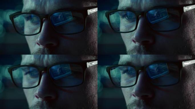 在计算机上工作的软件工程师的特写肖像，在眼镜中反射的代码行。开发人员使用机器学习，AI算法，大数据开