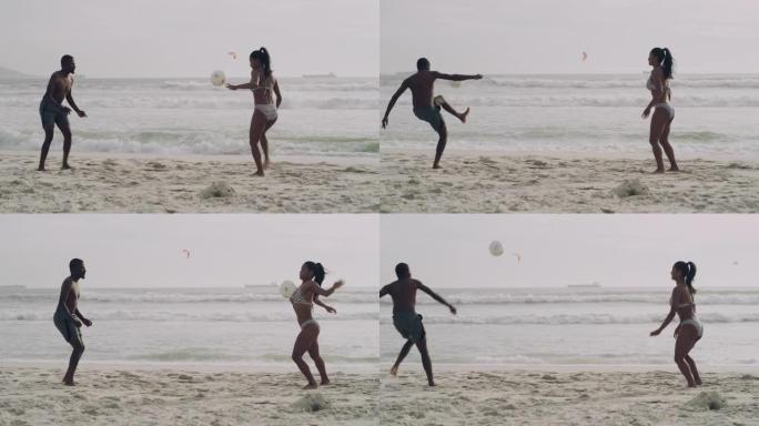 两个年轻朋友在海滩上玩足球的4k视频片段