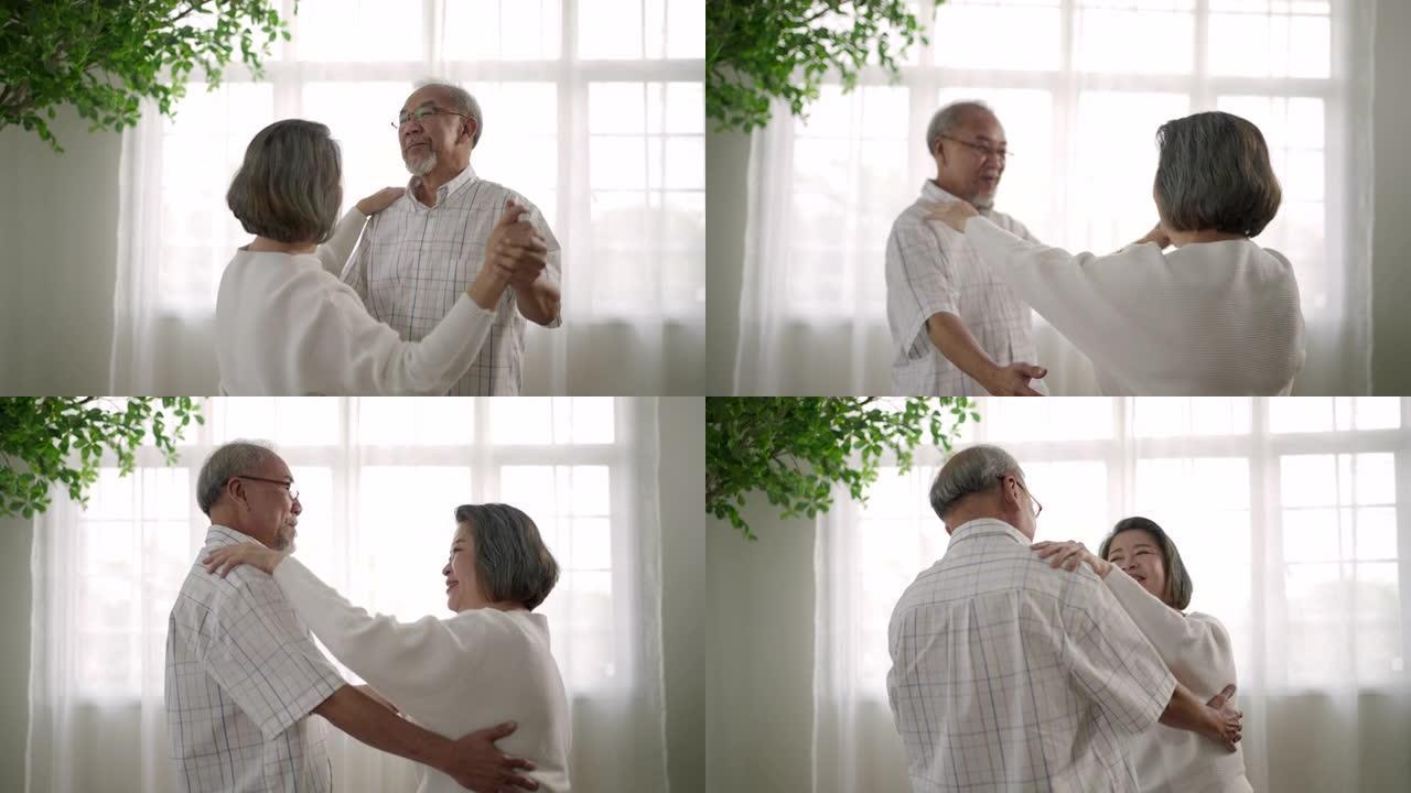 亚洲老年夫妇在家客厅跳舞，慢动作