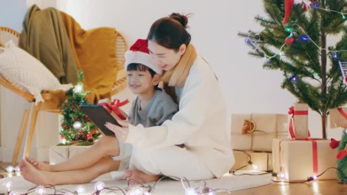 小男孩在线视频通话，父亲庆祝圣诞节社交距离。