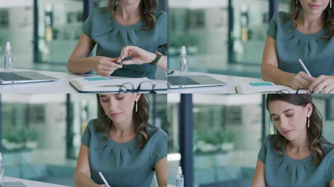 一位年轻女商人使用笔记本电脑并在现代办公室写笔记的4k视频片段
