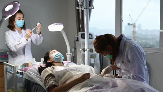 亚裔华裔女医生护士抽取年轻女子血样