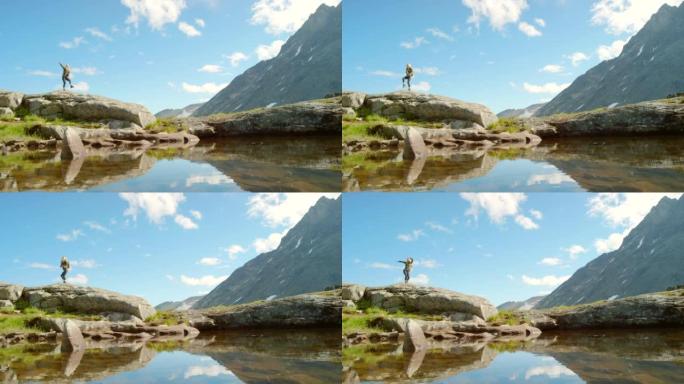 4k视频片段，一个无法识别的女人在探索m ø re og Romsdal的山脉时兴奋地跳舞