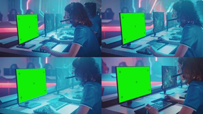 职业女孩玩电脑视频游戏，在锦标赛上显示绿屏，对着耳机说话。专业游戏玩家组成的多元化Esport团队在