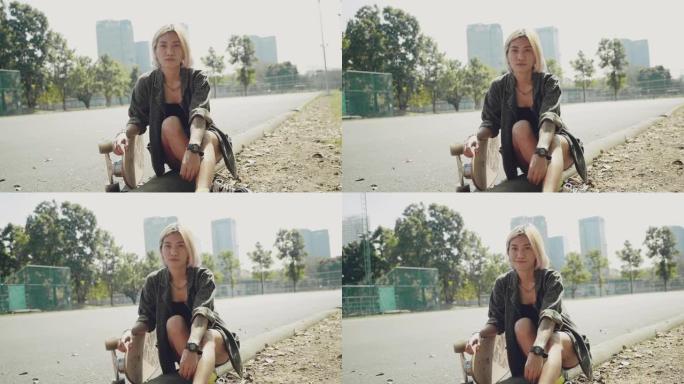 阳光灿烂的日子，在公园里玩滑板的少女。