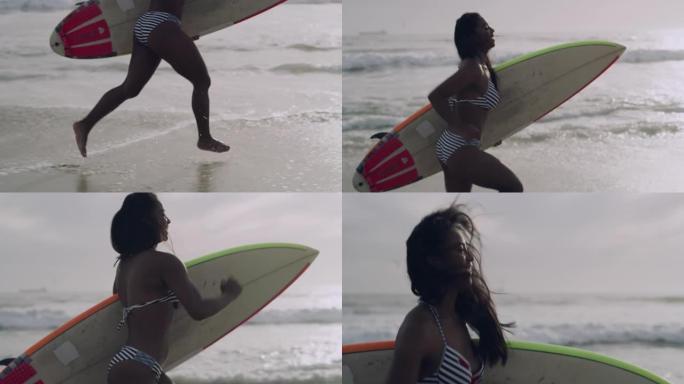 4k视频片段，一位迷人的年轻女子拿着冲浪板沿着海滩奔跑