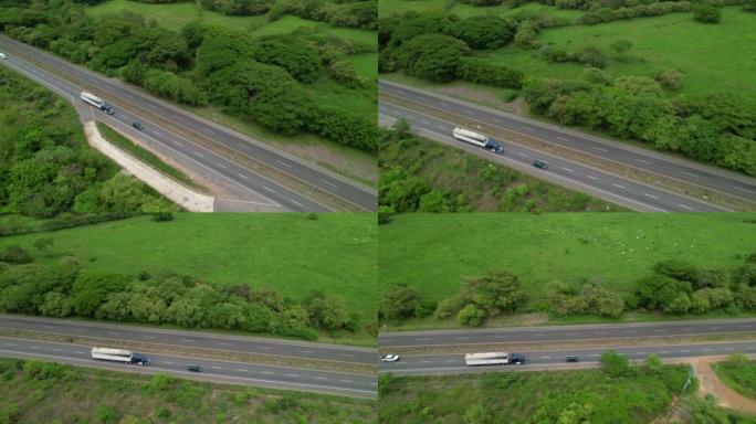 空中: 一辆货运卡车在巴拿马农村运输货物的无人机视图。