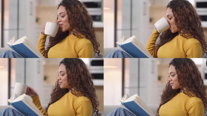 4k视频片段，一名年轻女子在沙发上喝咖啡放松，在家看书