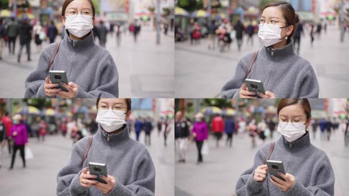 亚洲女子戴口罩行走都市