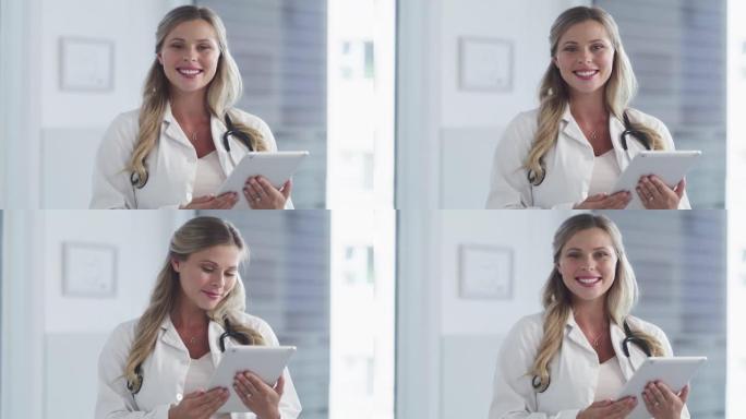 一位有吸引力的年轻女医生在医院工作时使用平板电脑的4k视频片段