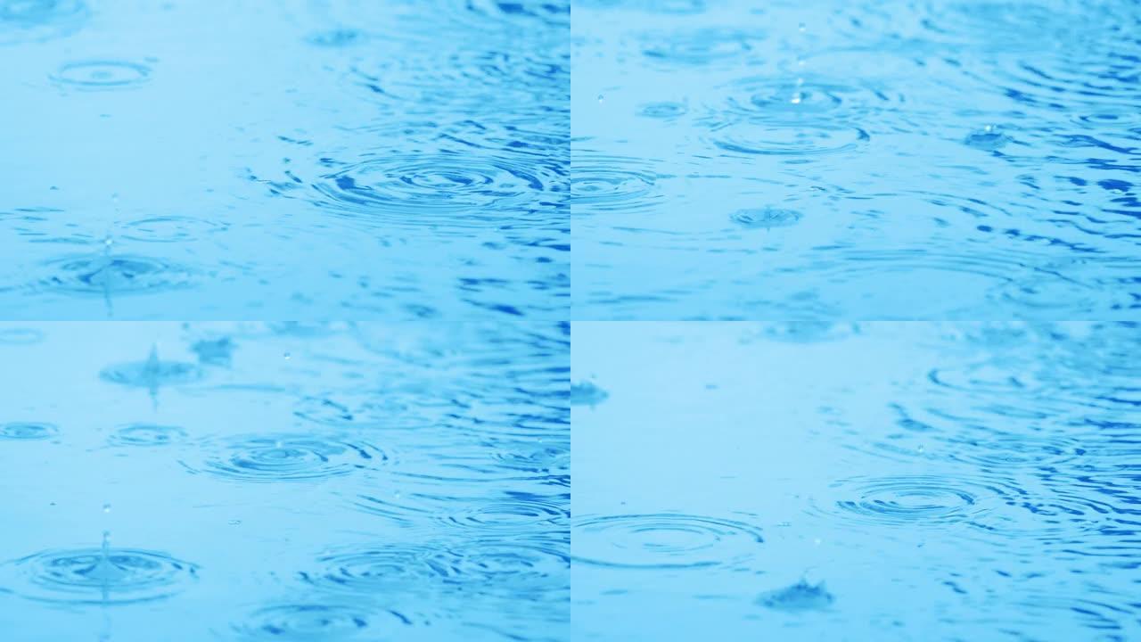 雨水溅到游泳池特写镜头上