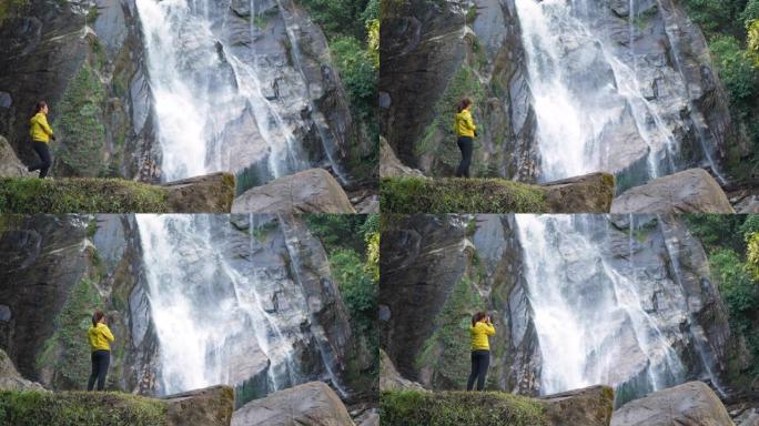 摄影师徒步旅行到瀑布